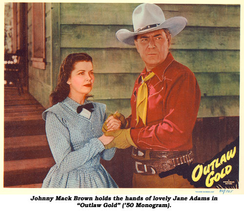 Johnny Mack Brown holds the hands of lovely Jane Adams in "Outlaw Gold" ('50 Monogram).