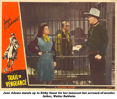 Jane Adams stands up to Kirby Grant for her innocent but accused-of-murder father, Walter Baldwin, on this lobbycard from "Trail to Vengeance".