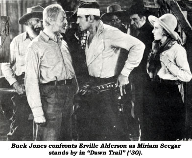 Buck Jones confronts Erville Alderson as Miriam Seegar stands by in "Dawn Trail" ('30).