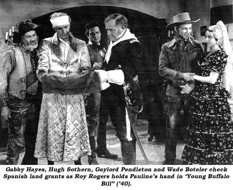 Gabby Hayes, Hugh Sothern, Gaylord Pendleton and Wade Boteler check Spanish land grants as Roy Rogers holds Pauline's hand in "Young Buffalo Bill" ('40).