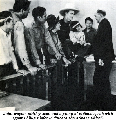 John Wayne, Shirley Jean and a group of Indians speak with agent Phillip Kiefer in "'Neath the Arizona Skies".