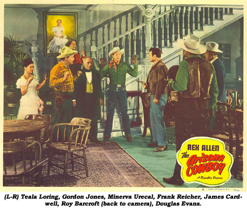 (L-R) Teala Loring, Gordon Jones, Minerva Urecal, Frank Reicher, James Cardwell, Roy Barcroft (back to camera), Douglas Evans in this scene card from "The Arizona Cowboy" starring Rex Allen.