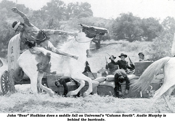 John "Bear" Hudkins does a saddle fall on Universal's  "Column South". Audie Murphy is behind the barricade.