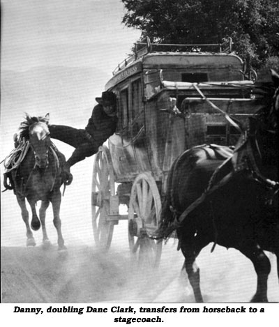 Danny, doubling Dane Clark, transfers from horseback to a stagecoach.