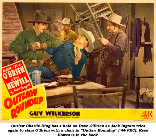 Outlaw Charlie King has a hold on Dave O'Brien as Jack Ingram tries again to slam O'Brien with a chair in "Outlaw Roundup" ('44 PRC). Reed Howes is in the back.