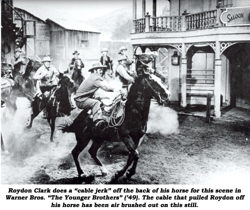 Roydon Clark does a "cable jerk" off the back of his horse for this scene in Warner Bros. "The Younger Brothers" ('49). The cable that pulled Roydon off his horse has been air brushed out on this still.