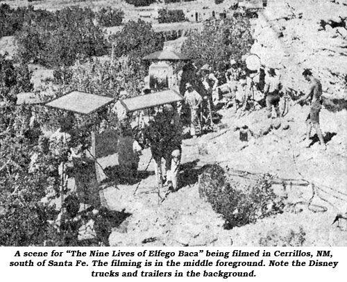 A scene for "The Nine Lives of Elfedo Baca" eing filmed in cerrillos, NM, south of Santa Fe. The filming is in the middle foreground. Note the Disney trucks and trailers in the background.