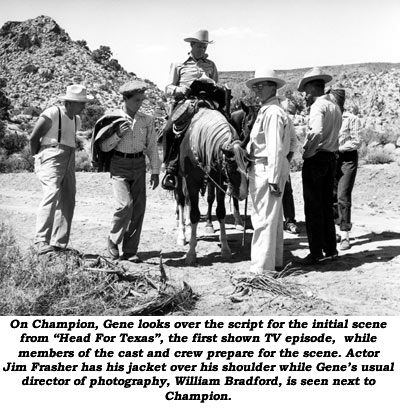 On Champion, Gene looks over the script for the initial scene from "Head For Texas", the first shown TV episode, while members of the cast and crew prepare for the scene. Actor Jim Frasher has his jacket over his shoulder while Gene's usual director of photography, William Bradford, is seen next to Champion.
