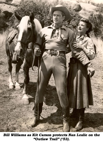 Bill Williams as Kit Carson protects Nan Leslie on the "Outlaw Trail" ('53).