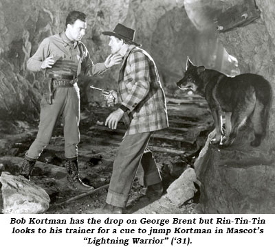 Bob Kortman has the drop on George Brent but Rin-Tin-Tin looks to his trainer for a cue to jump Kortman in Mascot's "Lightning Warrior" ('31).