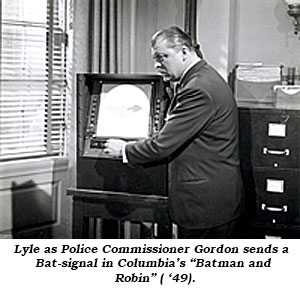 Lyle as Police Commissioner Gordon sends a Bat-signal in Columbia's "Batman and Robin" ( '49).