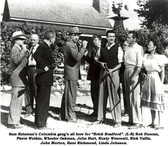 Sam Katzman's Columbia gang's all here for "Brick Bradford". (L_R) Bob Duncan, Pierre Watkin, Wheeler Oakman, John Hart, Rusty Wescoatt, Rick Vallin, John Merton, Kane Richmond, Linda Johnson.