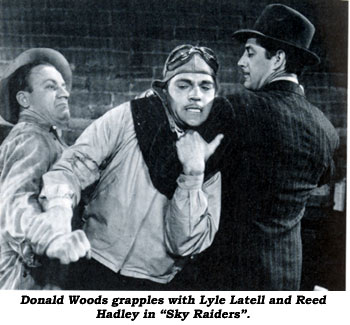 Donald Woods grapples with Lyle Latell and Reed Hadley in "Sky Raiders".