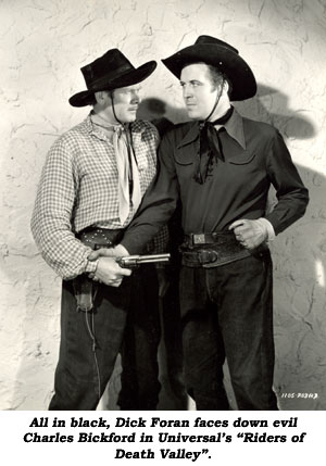 All in black, Dick Foran faces down evil Charles Bickford in Universal's "Riders of Death Valley".