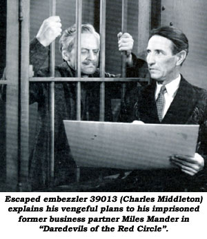 Escaped embezzler 39013 (Charles Middleton) explains his vengeful plans to his imprisoned former business partner Miles Mander in "Daredevils of the Red Circle".