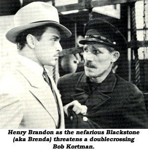 Henry Brandon as the nefarious Blackstone threatens a doublecrossing Bob Kortman.