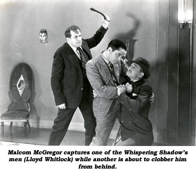 Malcolm McGregor captures one of the Whispering Shadow's men (Lloyd Whitlock) while another is about to clobber him from behind.