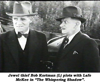 Jewel thief Bob Kortman (L) plots with Lafe McKee in "The Whispering Shadow".