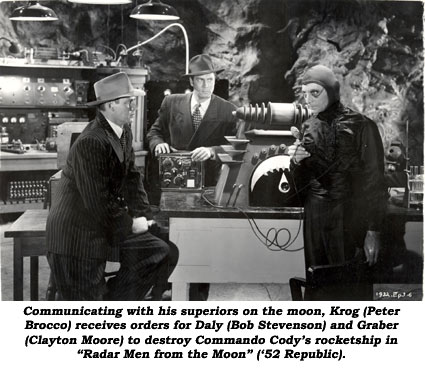 Communicating with his superiors on the moon, Krog (Peter Brocco) receives orders for Daly (Bob Stevenson) and Graber (Clayton Moore) to destroy Commando Cody's rocketship in "Radar Men From the Moon" ('52 Republic).