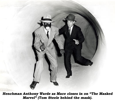 Henchman Anthony Warde as Mace closes in on "The Masked Marvel" (Tom Steele behind the mask).