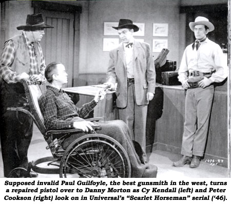 Supposed invalid Paul Guilfoyle, the best gunsmith in the west, turns a repaired pistol over to Danny Morton as Cy Kendall (left) and Peter Cookson (right) look on in Universal's "Scarlet Horseman" serial ('46).