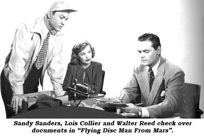 Sandy Sanders, Lois Collier and Walter Reed check over documents in "Flying Disc Man From Mars".