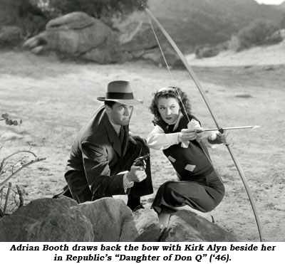 Adrian Booth draws back the bow wiht Kirk Alyn beside her in Republic's "Daughter of Don Q" ('46).