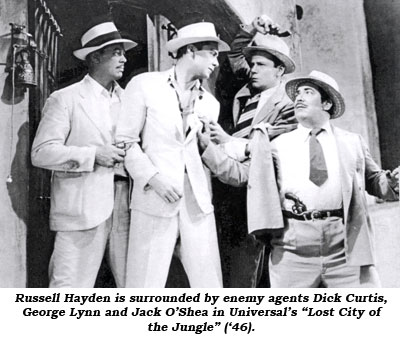 Russell Hayden is surrounded by enemy agents Dick Curtis, George Lynn and Jack O'Shea in Universal's "Lost City of the Jungle" ('46).