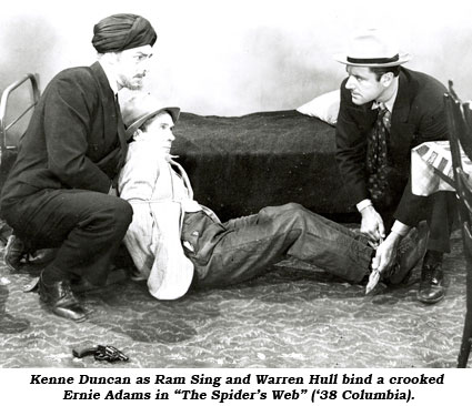 Kenne Duncan as Ram Sing and Warren Hull bind a crooked Ernie Adams in "The Spider's Web" ('38 Columbia).