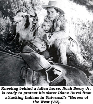 Kneeling behind a fallen horse, Noah Beery Jr. is ready to protect his sister Diane Duval from attacking Indians in Universal's "Heroes of the West" ('32).