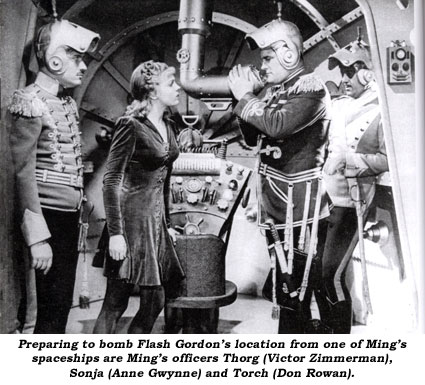 Preparing to bomb Flash Gordon's location from one of Ming's spaceships are Ming's officers Thorg (Victor Zimmerman), Sonja (Anne Gwynne) and Torch (Don Rowan).