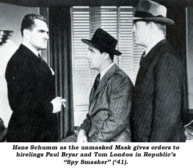 Hans Schumm as the unmasked Mask gives orders to hirelings Paul Bryor and Tom London in Republic's "Spy Smasher" ('41).