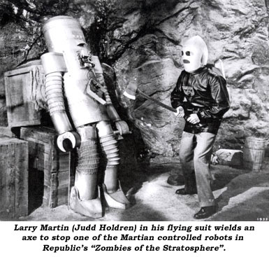 Larry Martin (Judd Holdren) in his flying suit wields an axe to stop one of the Martian controlled robots in Republic's "Zombies of the Stratosphere".