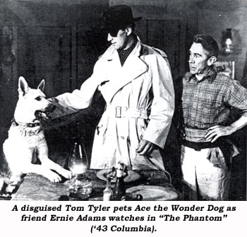 A disguised Tom Tyler pets Ace the Wonder Dog as friend Ernie Adams watches in "The Phantom" ('43 Columbia).