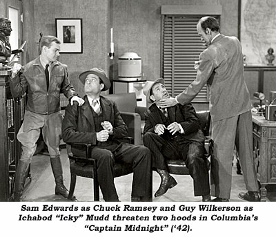 San Edwards as Chuck Ramseu and Guy Wilkerson as Ichabod "Icky" Mudd threaten two hoods in Columbia's "Captain Midnight" ('42).