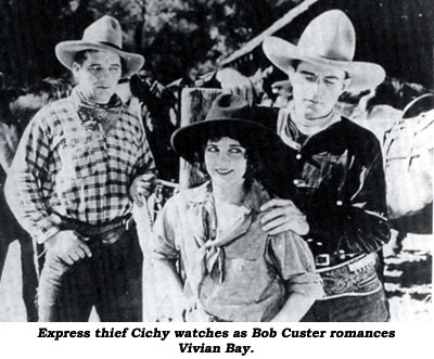 Express thief Cichy watches as Bob Custer romances Vivian Bay in "Code of the West".