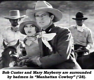 Bob Custer and Mary Mayberry are surrounded by badmen in "Manhattan Cowboy" ('28).