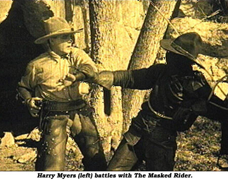 Harry Meyers (left) battles with The Masked Rider.