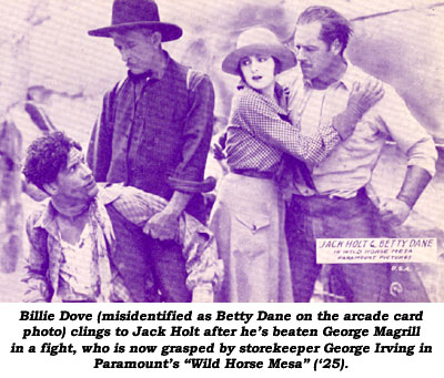 Billie Dove (misidentified as Betty Dane on the arcade card photo) clings to Jack Holt after he's beaten George Magrill in a fight, who is now grasped by storekeeper George Irving in Paramount's "Wild Horse Mesa" ('25).