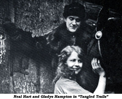 Neal Hart  and Gladys Hampton in "Tangled Trails".
