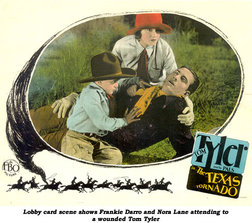 Lobby card scene shows Frankie Darro and Nora Lane attending to a wounded Tom Tyler