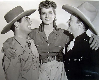 Johnny Mack Brown and Bob Baker give a lift to their “Riders of Pasco Basin” leading lady Frances Robinson. (Thanx to Bobby Copeland.)