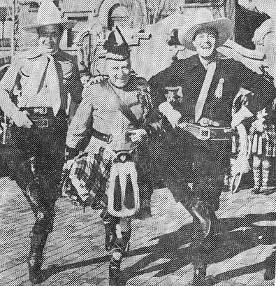 In Albuquerque, NM, for the annual Route 66 Convention in March 1939, Monte Blue (left) and Charles Starrett (right) indulbed in a little impromtu Highland Fling before startled but amused crowds.