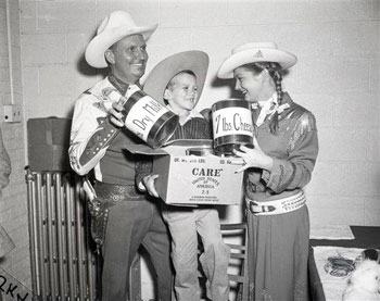 Gene Autry, Gail “Annie Oakley” Davis and five year old Mark Ryan help promote C.A.R.E. in 1956 Chicago. (Thanx to Roy Bonario.) 