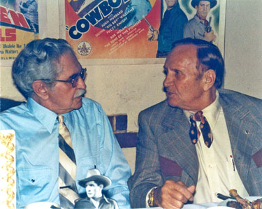 Gene talks with Bob Steele as Steele is honored by the Masquers Club on 
November 20, 1982. 