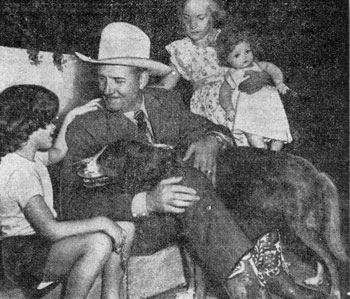 Denise Dennem, 6, (left) of Chicago tells Gene all about her dog Patches while Elizabeth Langdon, 8, waits to present her doll to Gene. Photo taken during a Name Champion’s Colt contest sponsored by the CHICAGO SUN-TIMES in 1948.