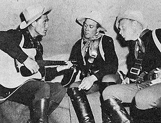 Ken Curtis, Ben Johnson and Harry Carey Jr. harmonize on the set of 
“Rio Grande” (‘50 Republic). 