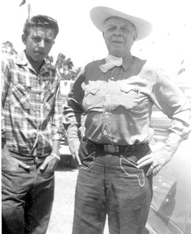 Hoot Gibson poses with a young fairgrounds worker in ?? 