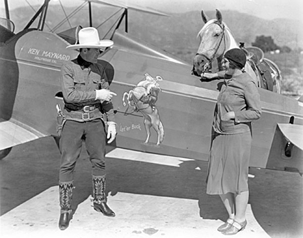 Ken Maynard, his wife Bertha, Tarzan and Ken’s private plane. 