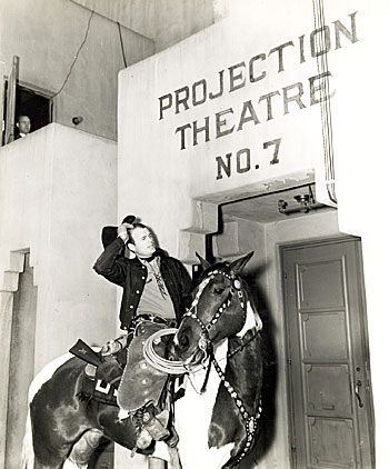Bob Baker rides up on Apache to a Universal studio projection room to view his latest, “Border Wolves” (‘38). (Thanx to Neil Summers.) 